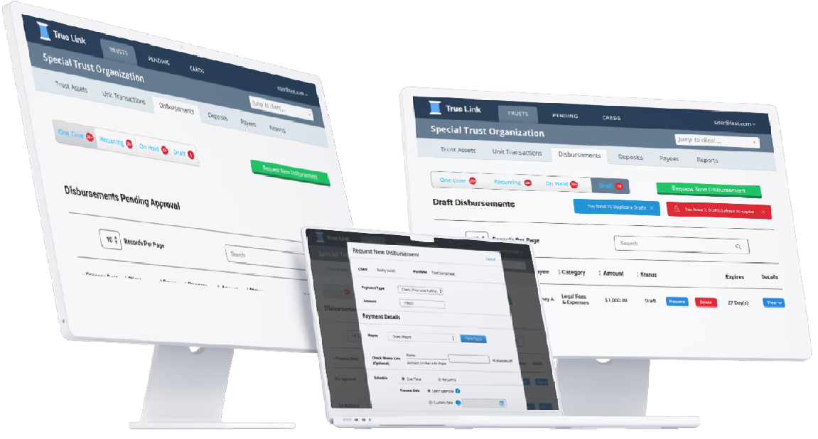 True Link disbursement screens shown on two desktop monitors and a laptop.